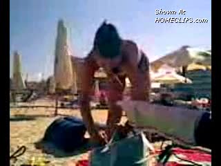 Pic #1Undressing On Beach