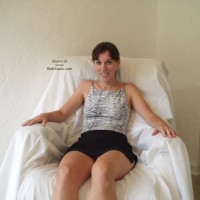 Pic #1Amy Fondling Herself On A Chair With Fingers