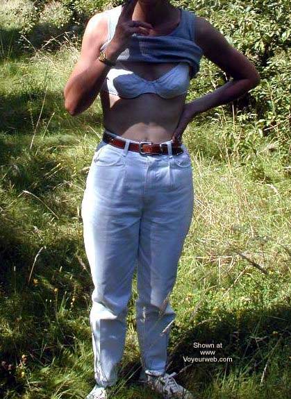 Pic #1Hairy Delphine Stripping in The Bush