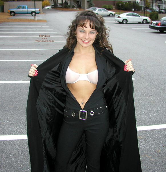 Flashing In Car Park - Looking At The Camera, Sexy Body , Flashing In Car Park, Dressed In Black, Showing Bra, Smiling At Camera, Long Red Fingernails, Tight Body