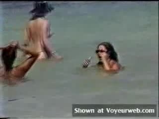 Pic #1Topless Lady Strolling The Beach