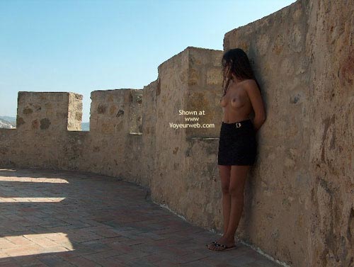 Against A Wall - Nude Outdoors, Topless In Public , Against A Wall, Outdoors, Naked Breasts In Public, Topless In Public, Posing By Wall, Flip Flop Sandals, Black Skirt