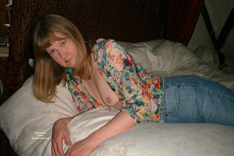 Pic #1 Topless Amateur Stripping In Front Of The Cam