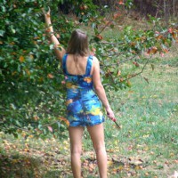 Pic #1Hot Milf In The Yard In A Short Dress