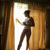 Morning Coffee In Hand , Toned Legs, Drinking Coffee, Athletic Build, Housewife Window, Toned Body, Purple Panties, White Tank Top, Sunlight Reflection, Coffe Break Against The Light, Peek-a-boo, Morning Sun Kissing Panties, Standing In Window