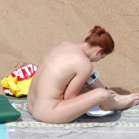 Redhead On The Red Rock Beach