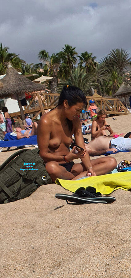 Pic #1not 1 but 2 different asian girls topless on beach