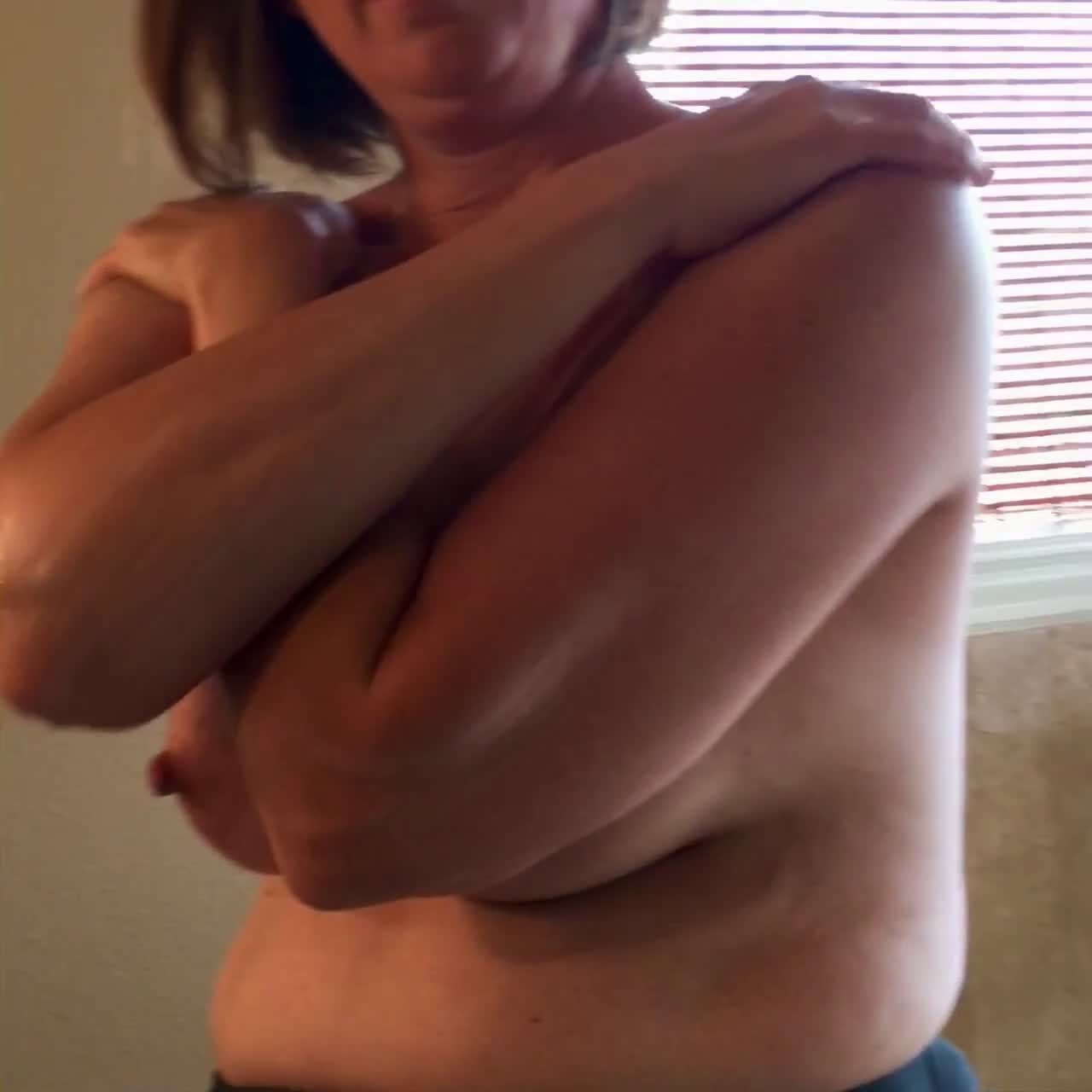 Pic #1The hot milf amber putting some lotion on her 34DD tits