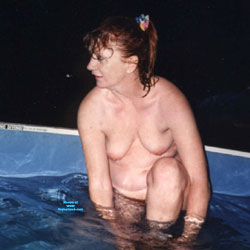 Pic #1 taking off her suit