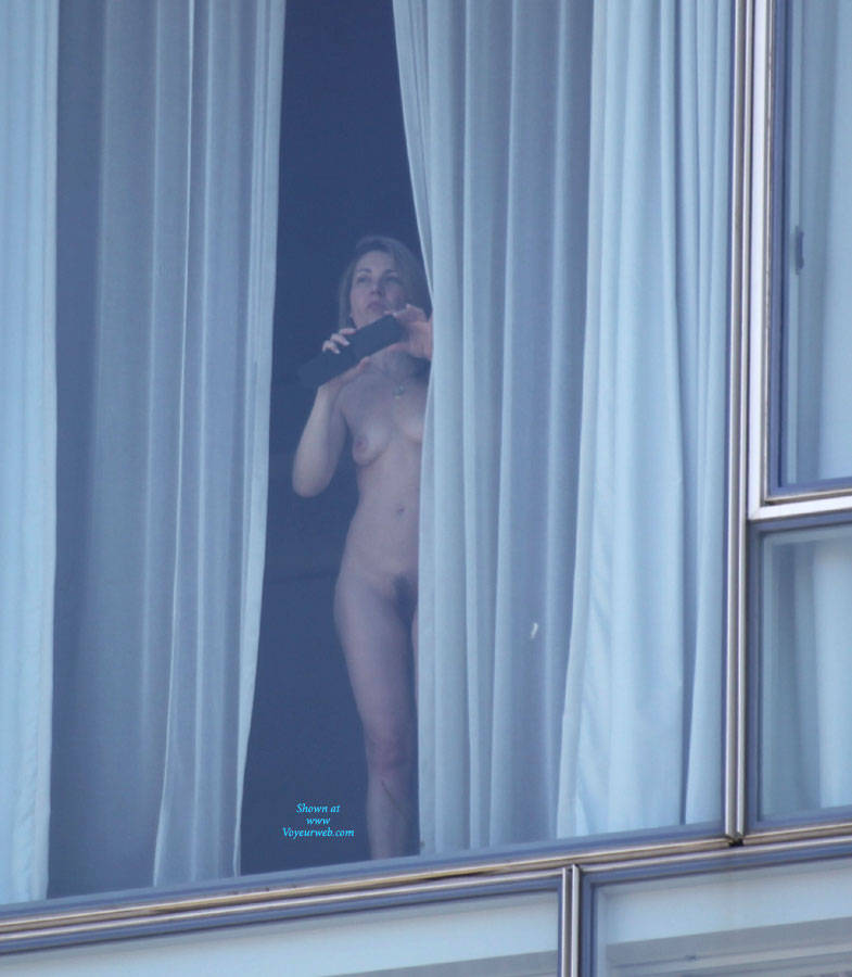 Pic #1Playful Woman An A Window