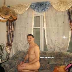 Me on the sofa in the living room, some years, ago.