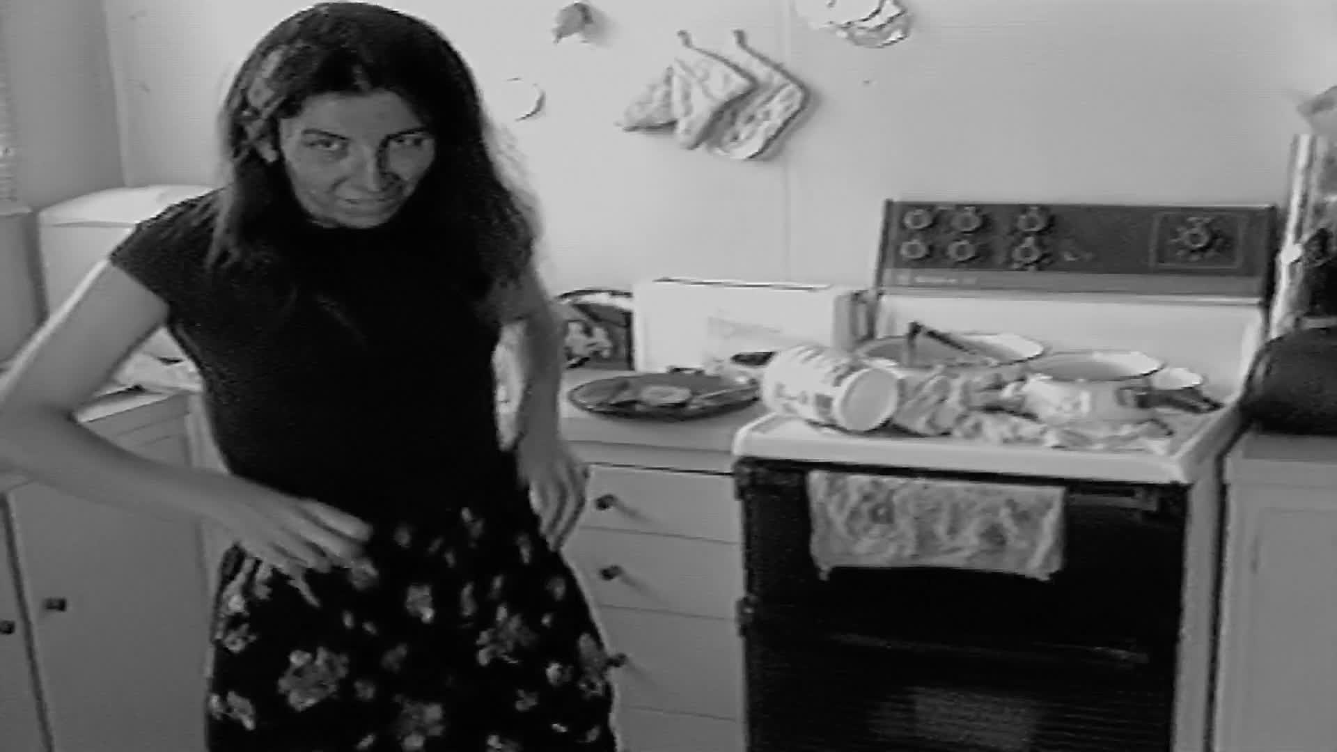 Pic #1Sue pulls down her pants and cleans the kitchen