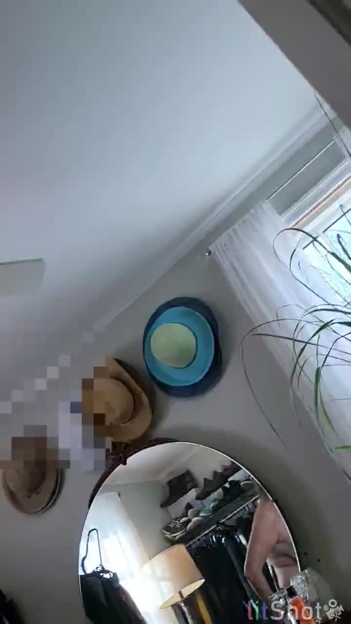 Pic #1Putting on her J cup bra