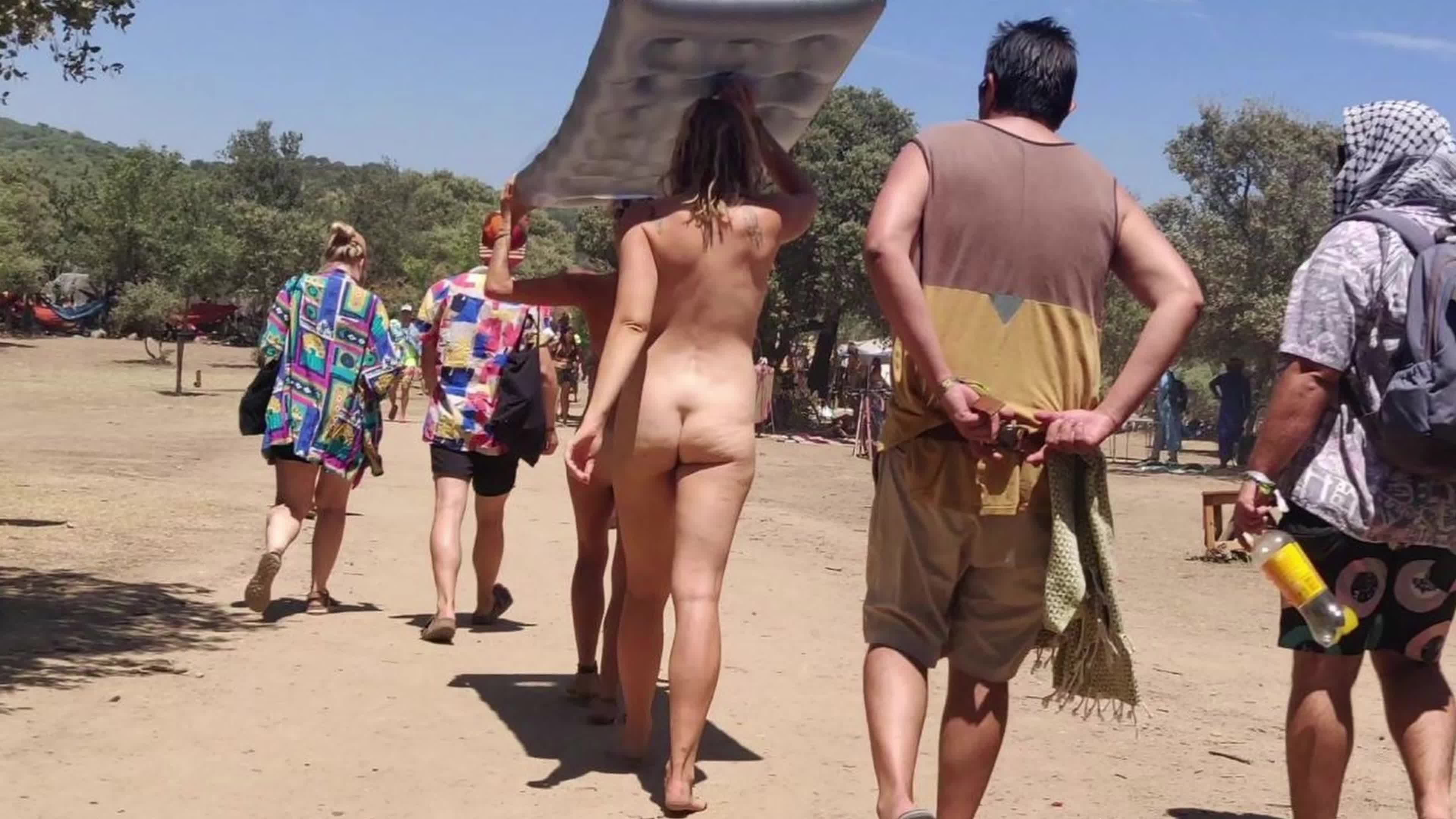 Pic #1  2 girls walking full naked at festival
