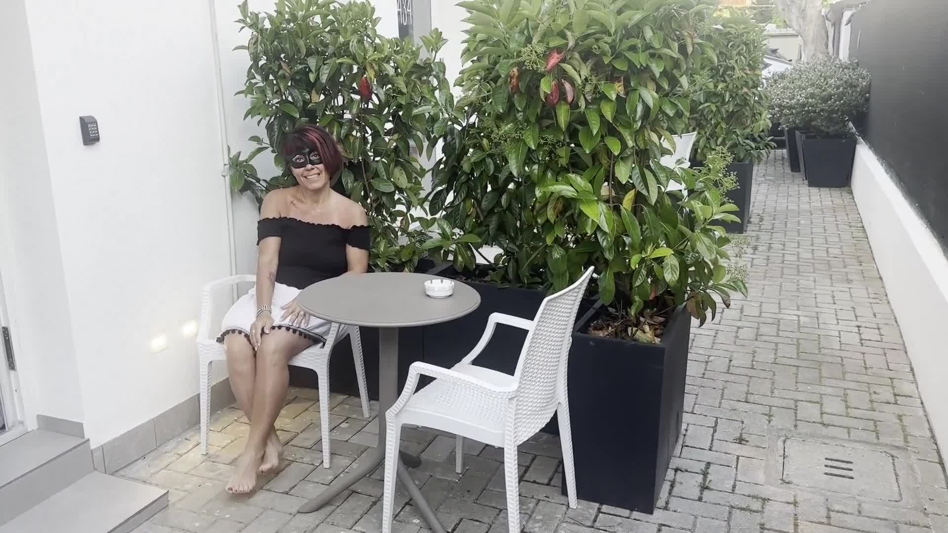 Pic #1Showing tits outdoors and undressing in front of glass french door