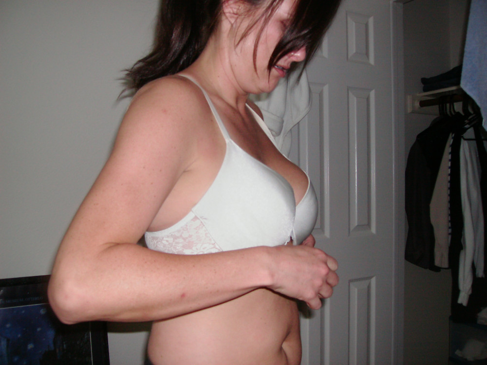 Pic #1 Jennifer getting undressed and showing her tits.